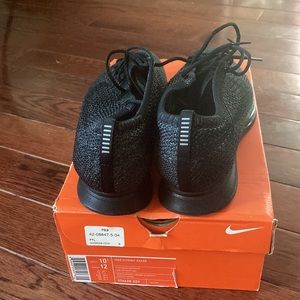 2016 Nike Flynit Racer. Tripe black. Features black and Anthracite FlyKnite.